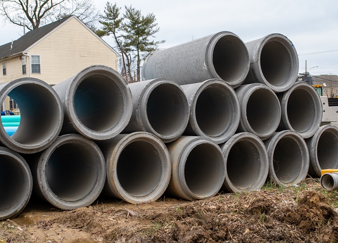 concrete round big pipes stacked outdoors sewer large water materials new heavy big